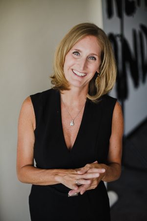  Laura Richeson standing in black dress smiling